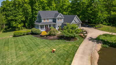 crew looking at front lawn from aerial view 