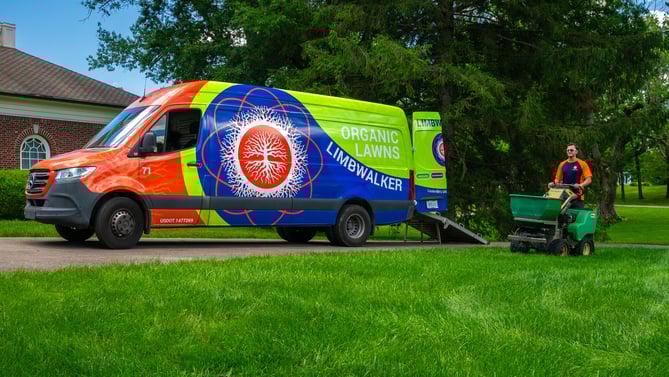 Limbwalker van and lawn care technician in yard