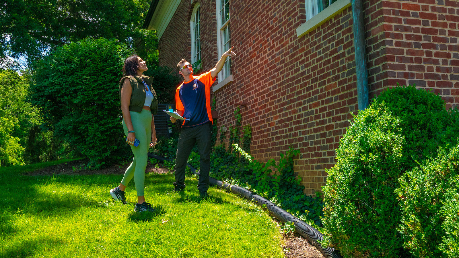 pest control technician with customer doing inspection 1