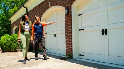 pest control technician and customer walking property