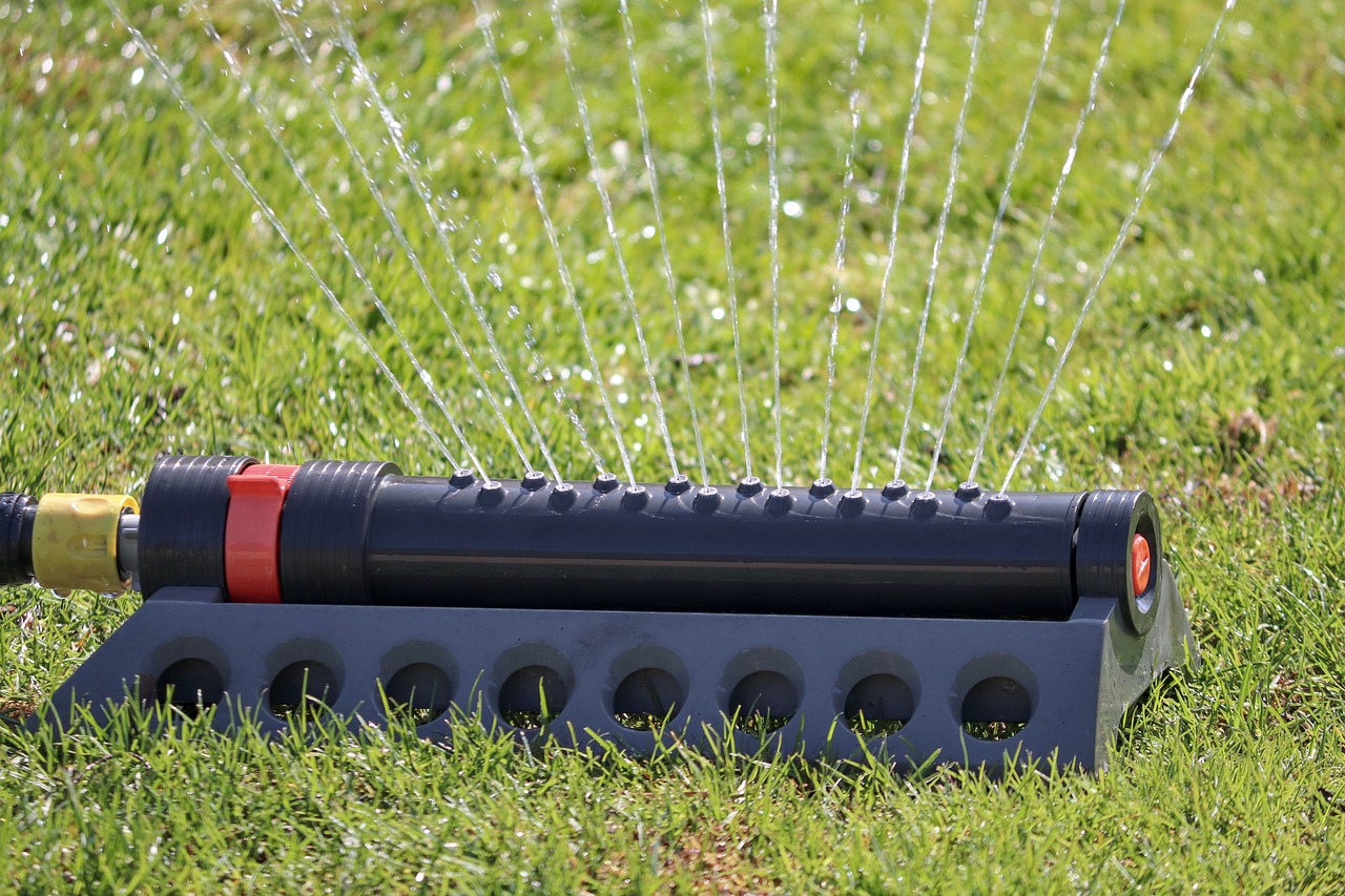watering lawn with sprinkler 
